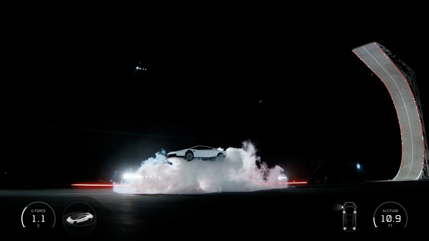 Tesla Roadster above the ground over a dense thruster plume, beside the demonstration ramp in Tesla's official event footage.